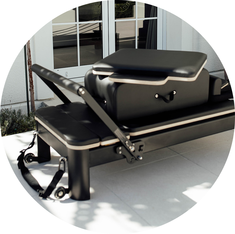 Black and wooden pilates reformer